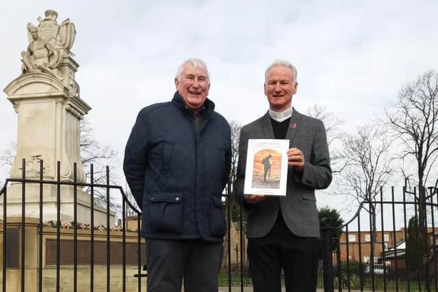 Fr Nicholas Hird and John Brook in front of the Spenborough War Memorial, Cleckheaton