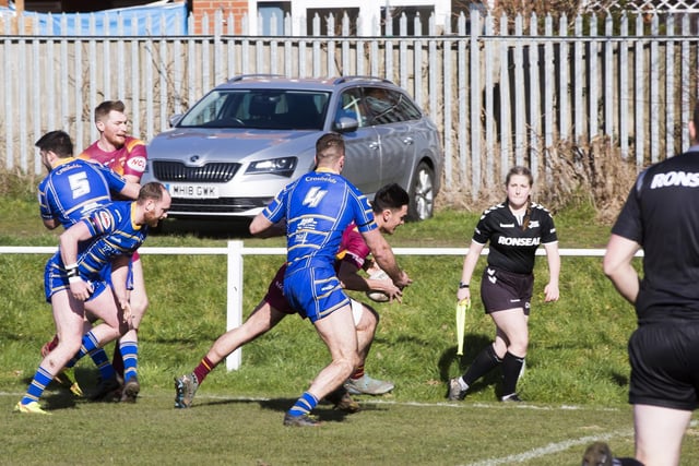 Dewsbury Moor Maroons' Jacob Beety goes for the corner. Picture: Jim Fitton