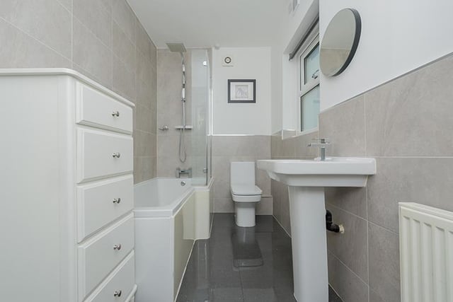 With both bath and shower, this bathroom suite in white is clean and fresh.