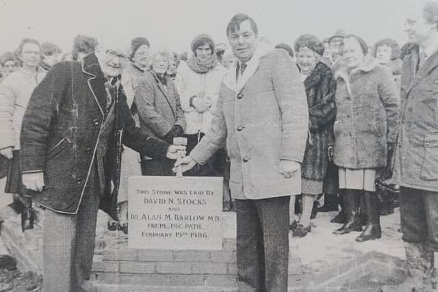 Dr Alan Barlow (left) and David Stocks (right) lay the foundation stone in February 1986