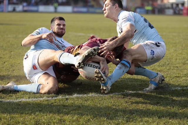 Conor Carr's brave finish brings him a debut score and Batley Bulldogs their second try against Featherstone Rovers. Picture: Neville Wright