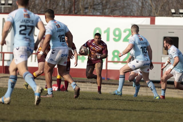 Batley Bulldogs' Greg Johnson runs at the Featherstone Rovers defensive line. Picture: Neville Wright