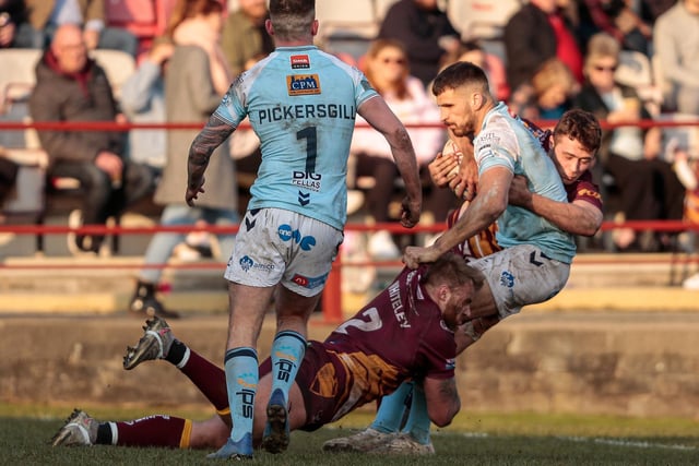 Batley's Perry Whiteley and Conor Carr team up to stop a Featherstone attack. Picture: Neville Wright