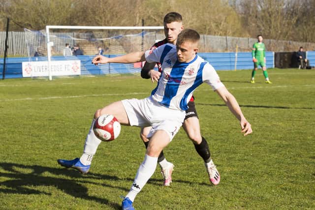 Lewis Whitham takes control of the ball in Liversedge's game with Sheffield FC. Picture: JIm Fitton