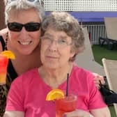 Karen and her mum enjoy cocktails on holiday.