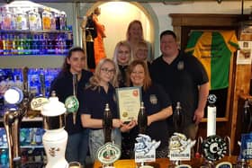 Staff at The Savile Arms in Thornhill with the Heavy Woollen CAMRA branch's pub of the season award for autumn 2021