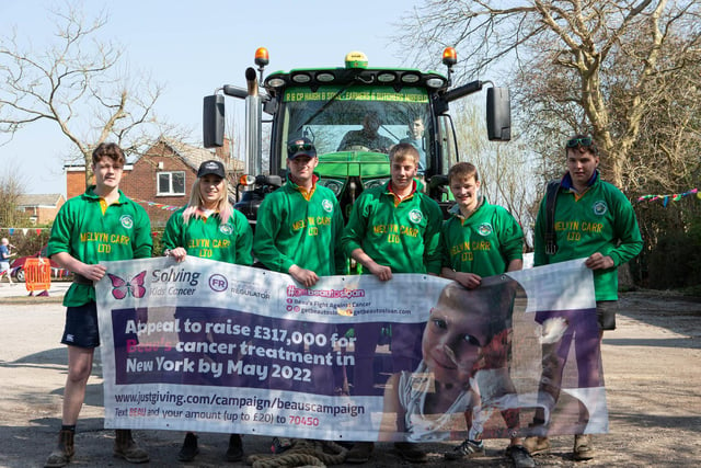 The Penistone Young farmers team holding Beau's campaign banner.