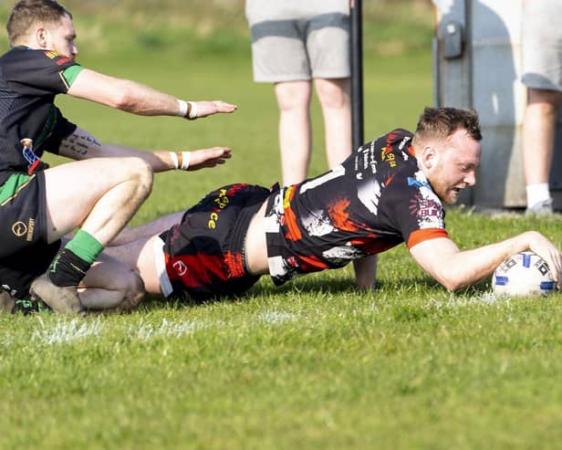Jack Raby dives over for one of his two tries for Eastmoor Dragons against Shaw Cross Sharks. Picture: Scott Merrylees