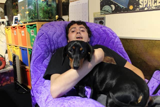 Lewis Turner with Natasha, the family’s Dachshund, in June 2019