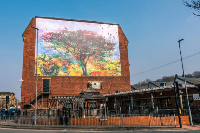 “The Tree of Life” mural was designed by artist Tom Wood.