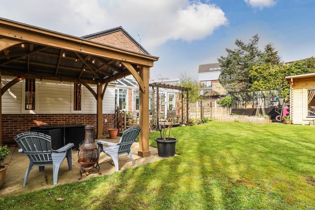 The enclosed garden lends itself to entertaining, with this seating area.