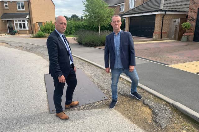 Dewsbury MP Mark Eastwood and community campaigner Keith Mallinson, who have both raised concerns about the state of the Harron Homes development at Amberwood Chase in Dewsbury