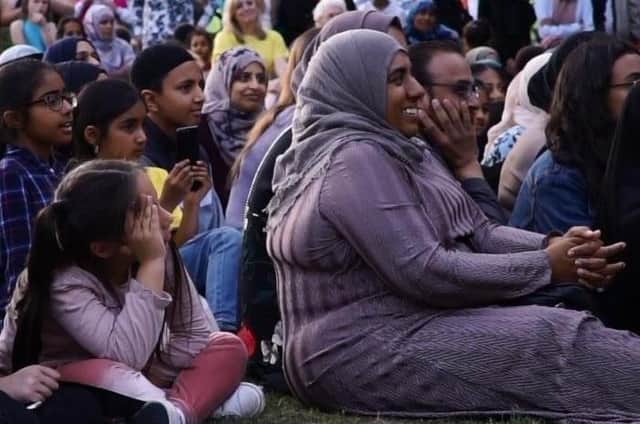 Residents enjoy a speech by Kim Leadbeater at the Batley Iftar in 2018.