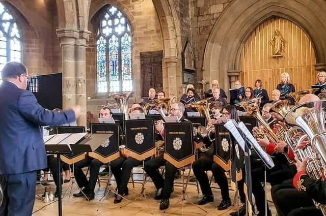 Dewsbury Community Choir performing its first concert at Dewsbury Minster, accompanied by the Yorkshire Imperial Brass Band