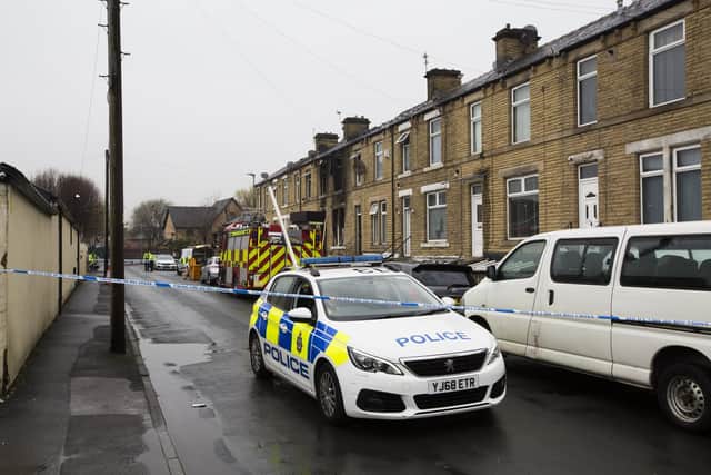 Emergency services vehicles today at the scene of the fatal fire on Queen Street, Ravensthorpe, Dewsbury