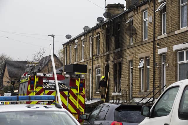 Emergency services vehicles today at the scene of the fatal fire on Queen Street, Ravensthorpe, Dewsbury