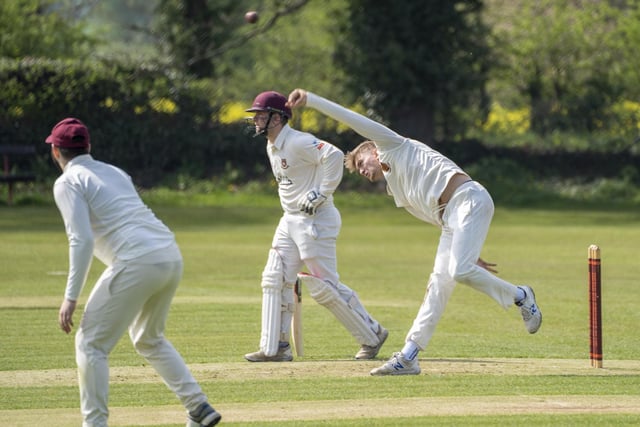 Methley's former Yorkshire spinner James Logan delivers on his way to taking three wickets. Picture: Scott Merrylees