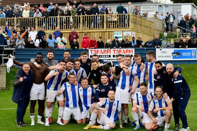 Liversedge FC players, management and supporters celebrate after a draw with Brighouse clinched them promotion barring a footballing miracle. Picture: Paul Butterfield