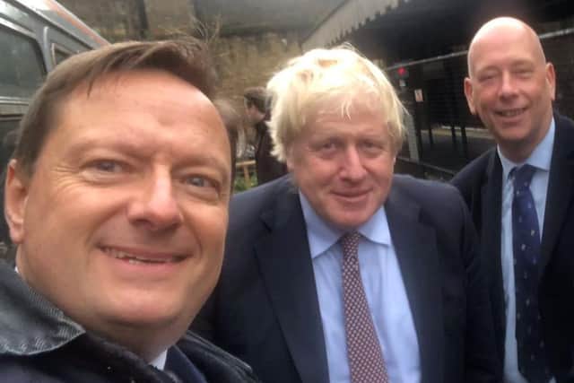 Colne Valley MP Jason McCartney, left, with Dewsbury MP Mark Eastwood, right, pictured with Prime Minister Boris Johnson during a whistlestop visit to Huddersfield last year