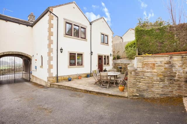 This property on Hare Park Lane, Liversedge, is priced at £395,000.
