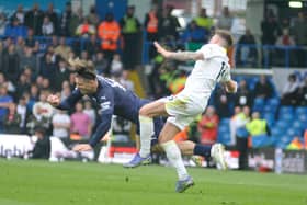 Stuart Dallas makes the challenge that led to him suffering a broken leg in Leeds United's game against Manchester City.