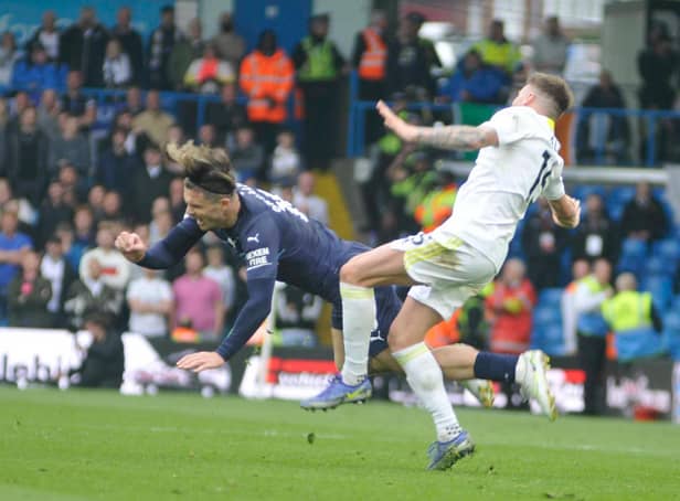 Stuart Dallas makes the challenge that led to him suffering a broken leg in Leeds United's game against Manchester City.