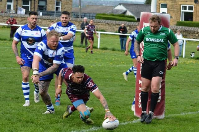 Joel Gibson gets the ball down over the line for the winning try for Thornhill Trojans against Siddal. Picture: Dave Jewitt