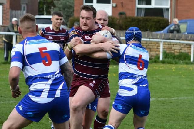 Dom Flanagan meets some strong defence as he attacks for Thornhill Trojans. Picture: Dave Jewitt