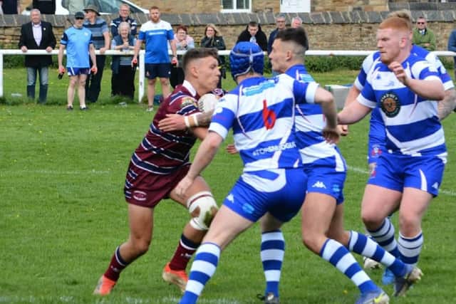 Bailey Lee takes on a number of Siddal tacklers during the National Conference League match. Picture: Dave Jewitt