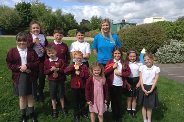 Double Olympic swimming champion Rebecca Adlington with pupils at Thornhill Junior and Infant School