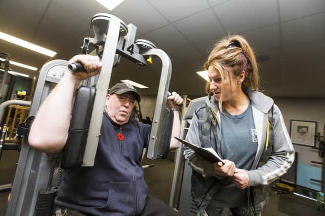 Tim Wood training for his weightlifting challenge, with adjudicator Jeannie Ellam, at Roy Ellam's Gym, Mirfield