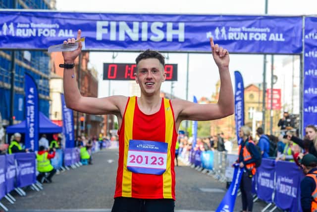 Joe Sagar crosses the line as a clear winner of the Leeds Half Marathon.