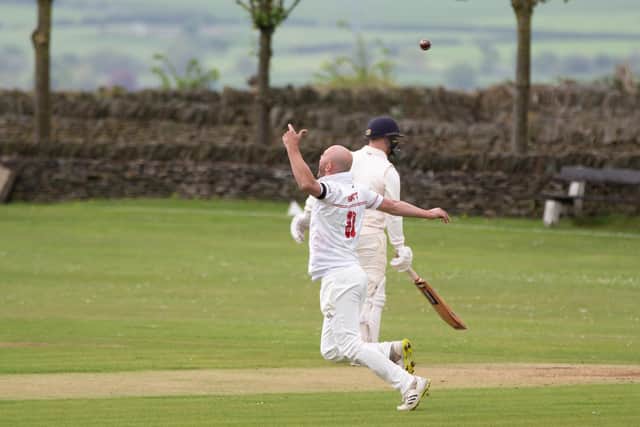 East Bierley bowler Dan Abbott celebrates taking a return catch to dismiss Birstall’s Andrew Robertson. Picture: Bruce Fitzgerald