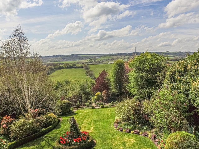 Fields, hedges, trees and grassy slopes all form part of the beautiful scenery.
