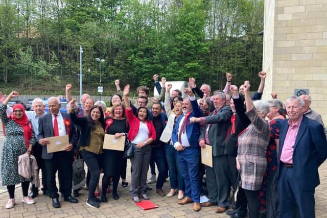Labour members and councillors celebrate winning a majority on Kirklees Council at last week's elections