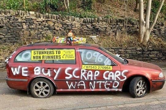 The car advertising a scrap dealership that was removed from a layby in Honley