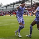 Leeds United's two goal heroes against Brentford, Jack Harrison and Raphinha, celebrate together.