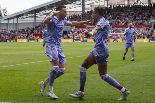 Leeds United's two goal heroes against Brentford, Jack Harrison and Raphinha, celebrate together.