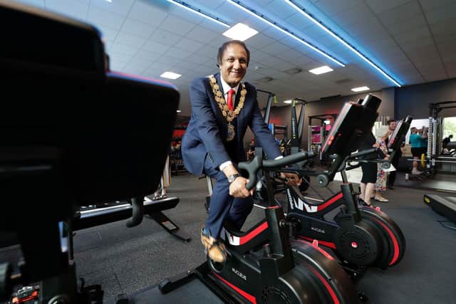 Mayor of Kirklees Coun Masood Ahmed tries out an exercise bike