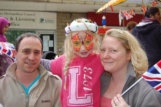 Gary and Julie Jenkins with daughter Hannah, 7, enjoying the Jubilee celebrations in Dewsbury.