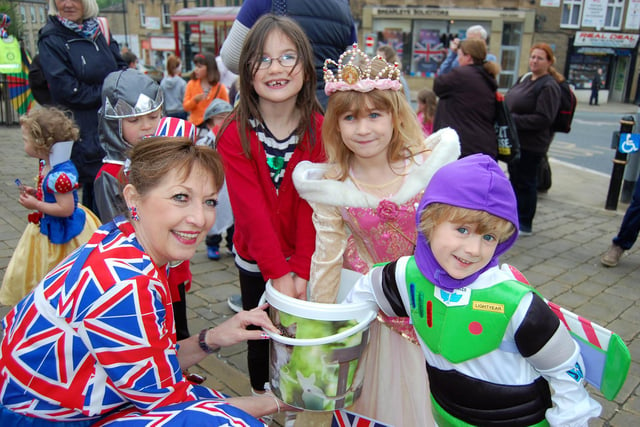 Birstall Jubilee Celebrations. Jill Mellor from the Fashion Workroom in Birstall with Georgia Lerums, Molly Lawford and Jake Lawford at the Jubilee fancy dress parade.