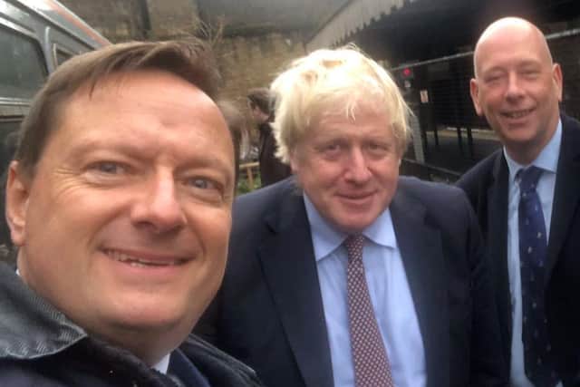 Colne Valley MP Jason McCartney, left, with Dewsbury MP Mark Eastwood, right, pictured with Prime Minister Boris Johnson during a whistlestop visit to Huddersfield last year