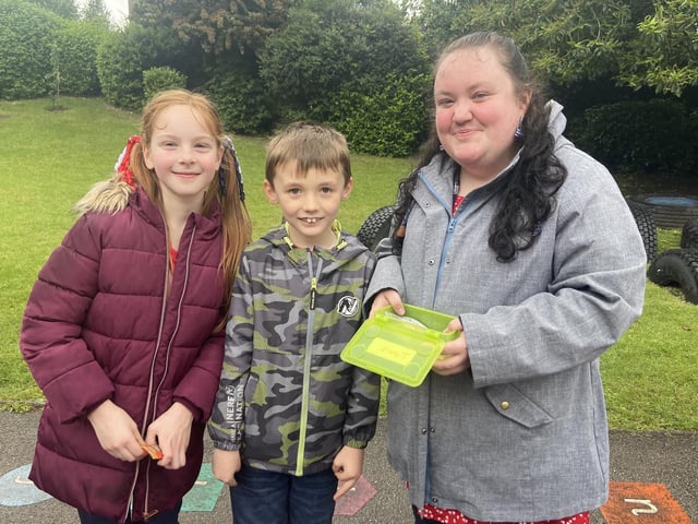 Alfie Cutten, Vivienne Shaw and Mrs Nash on the soap stall at Hanging Heaton Junior and Infant School