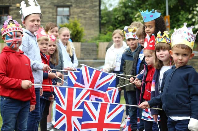 Pupils from Woodlands Primary School line up with Union Flags at St Andrew's Church, Oakenshaw, for the Oakenshaw Community Big Jubilee Lunch to celebrate the Queen's Platinum Jubilee. Photos by John Bradley