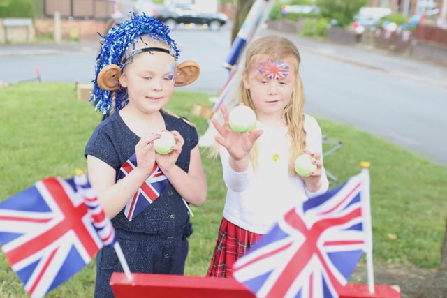 Edie and Orla play a traditional 1950s game as more than 140 residents gathered for a street party on Cornmill Drive, Liversedge
