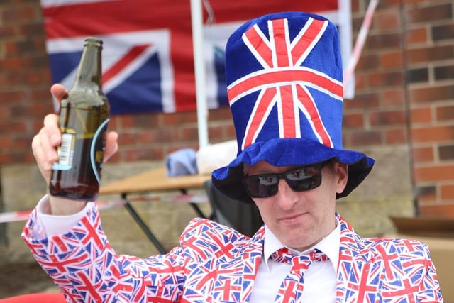 Dean Murray in a full Union Flag suit as 140 residents gathered for a street party on Cornmill Drive, Liversedge