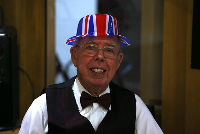 A gentleman wears a Union Flag hat at St John's Church, Cleckheaton, to celebrate the Queen's Platinum Jubilee