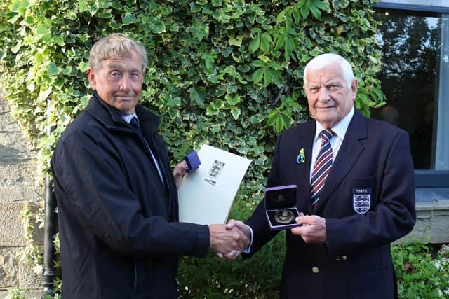 Rodney Smith was presented with an FA 50-year Service to Football Award by Barry Chaplin, chairman of the West Riding County FA.