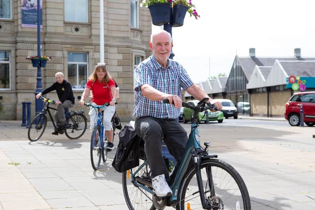 Dewsbury councillor Eric Firth on a bike at the launch event