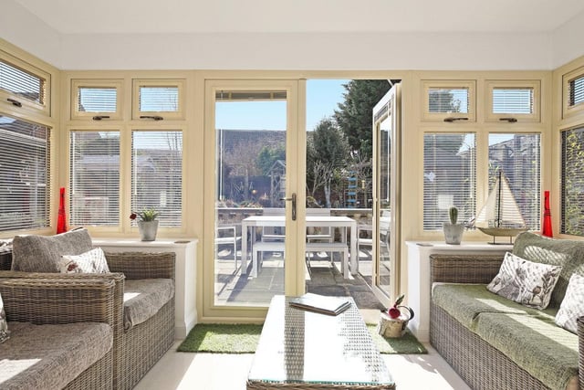 Patio doors lead out to a patio seating area.